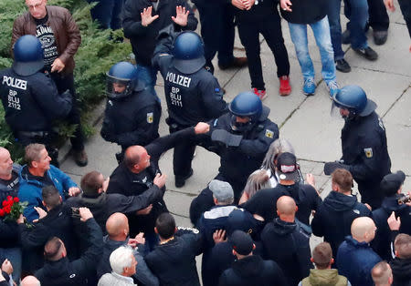 Far-right demonstrators scuffle with police in Chemnitz, Germany, September 1, 2018. REUTERS/Hannibal Hanschke/Files