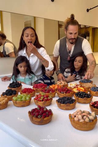 <p>Instagram/cedricgrolet</p> Zoe Saldaña, her husband Marco Perego and their three sons try the fruit tarts