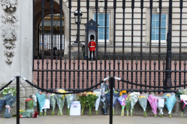 <p>Stuart C. Wilson/Getty</p> Floral tributes cordoned off at Buckingham Palace following the death of Prince Philip on April 9, 2021.