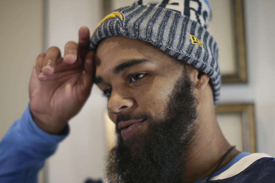 Los Angeles Chargers wide receiver Keenan Allen takes interviews after a training session at Allianz Park in London, Friday Oct. 19, 2018. The Los Angeles Chargers are preparing for an NFL football game against the Tennessee Titans at London's Wembley stadium on Sunday. (AP Photo/Tim Ireland)