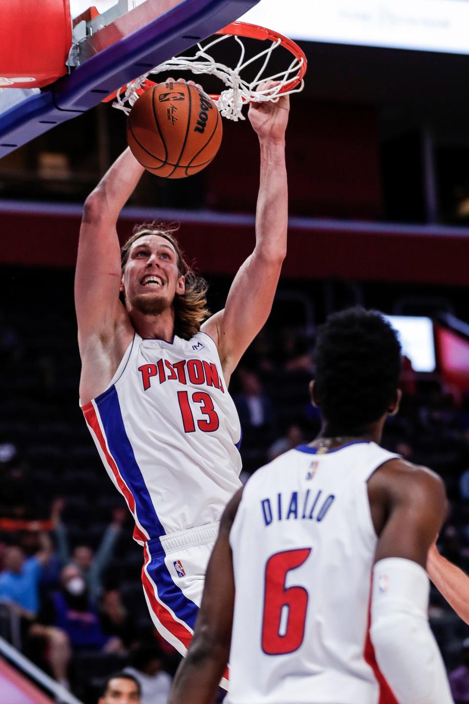 Detroit Pistons forward Kelly Olynyk (13) dunks against San Antonio Spurs during the second half of a preseason game at Little Caesars Arena in Detroit on Wednesday, Oct. 6, 2021.