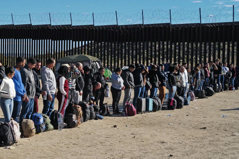 Migrants attempting to cross in to the U.S. from Mexico are detained by U.S. Customs and Border Protection in Jacumba Hot Springs, Calif. (Nick Ut / Getty Images file )