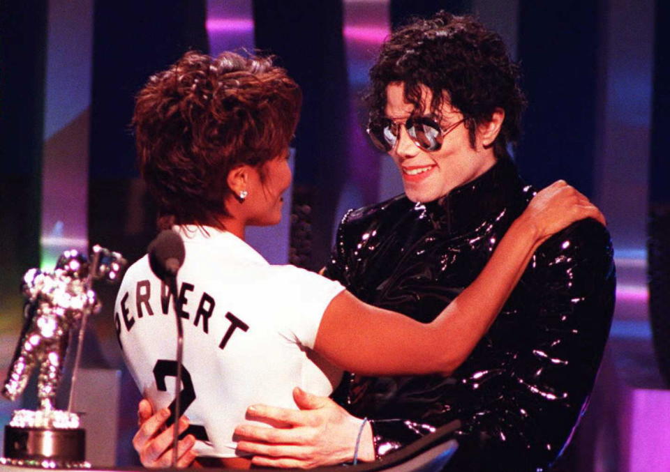 NEW YORK, NY - SEPTEMBER 7:  Singer Michael Jackson (R) hugs sister Janet after they won the award for Best Dance Video for their video "Scream"  07 September at the 1995 MTV Video Music Awards held at Radio City Music Hall in New York. The Jackson's video "Scream" was nominated for 11 awards.  AFP PHOTO  (Photo credit should read DON EMMERT/AFP/Getty Images)