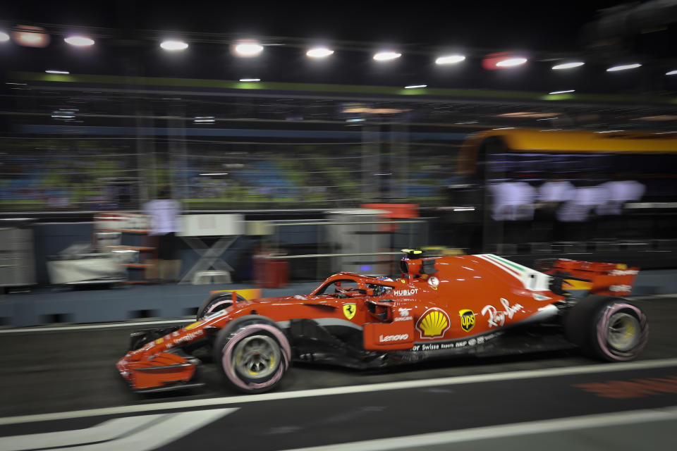 Ferrari driver Kimi Raikkonen of Finland leaves the pit during second practice at the Marina Bay City Circuit ahead of the Singapore Formula One Grand Prix in Singapore, Friday, Sept. 14, 2018. (AP Photo/Vincent Thian)