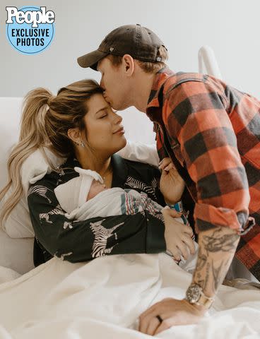 <p>Karis Marie Photography</p> Cassidy Montalvo and Cort Bogan with daughter Piper