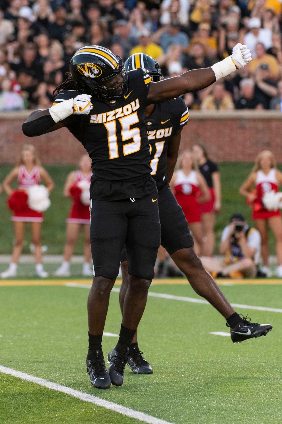 Missouri defensive lineman Johnny Walker Jr. celebrates a sack during the first quarter of an NCAA college football game against South Dakota Thursday, Aug. 31, 2023, in Columbia, Mo.