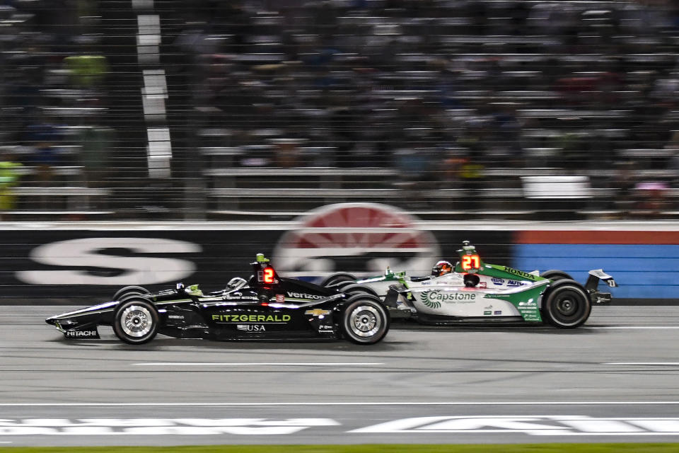 FILE - In this June 8, 2019, file photo, Josef Newgarden (2) battles Alexander Rossi (27) for position during an IndyCar auto race at Texas Motor Speedway, in Fort Worth, Texas. Newgarden can win his second IndyCar championship in three years in the season finale at historic Laguna Seca on Sunday. Newgarden leads Rossi in the standings. (AP Photo/Randy Holt, File)