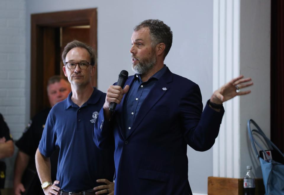 Metro Council member Ben Reno-Weber (center) speaks alongside Metro Council member Andrew Owen at an August 2023 community meeting in the aftermath of a shooting outside Afrokanza.