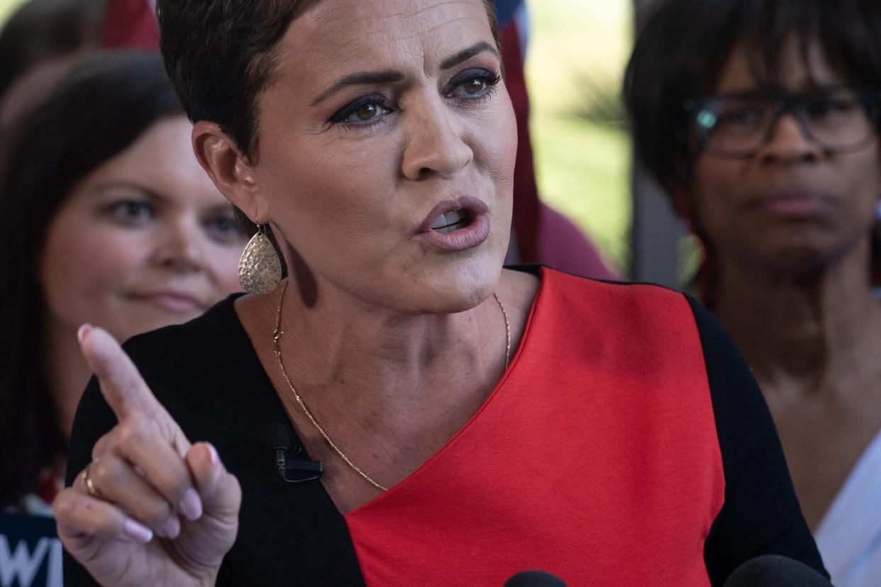 Kari Lake answers a question during a news conference, May 23, 2023, at her headquarters, 4040 E. Camelback Road, Phoenix.