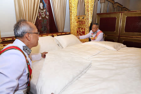 Royal officials make the bed of Thailand's King Maha Vajiralongkorn during the ceremony of Assumption of the Royal Residence inside the Grand Palace in Bangkok, Thailand, May 4, 2019. The Committee on Public Relations of the Coronation of King Rama X via REUTERS