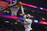 Dallas Mavericks center Daniel Gafford scores against the Sacramento Kings during the first half of an NBA basketball game in Sacramento, Calif., Tuesday, March 26, 2024. (AP Photo/José Luis Villegas)