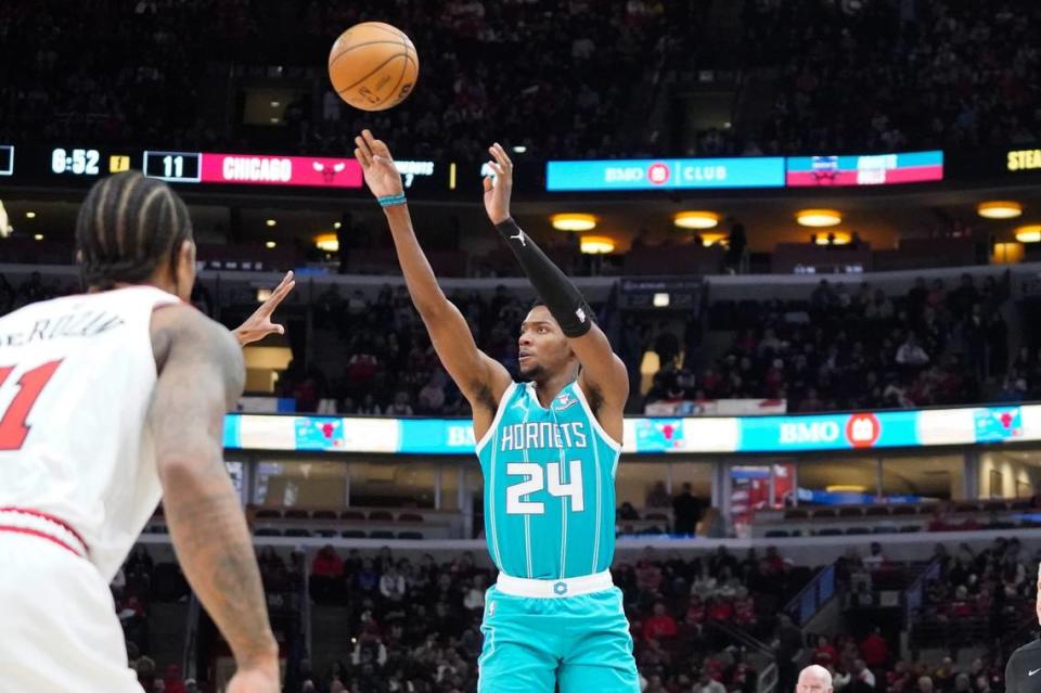 Charlotte Hornets forward Brandon Miller (24) shoots a three point basket against the Chicago Bulls during the first quarter at United Center.