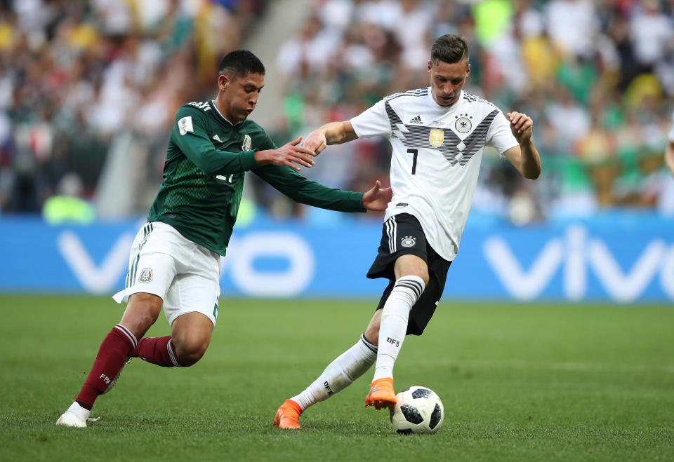 Germany's Julian Draxler in action with Mexico's Edson Alvarez.