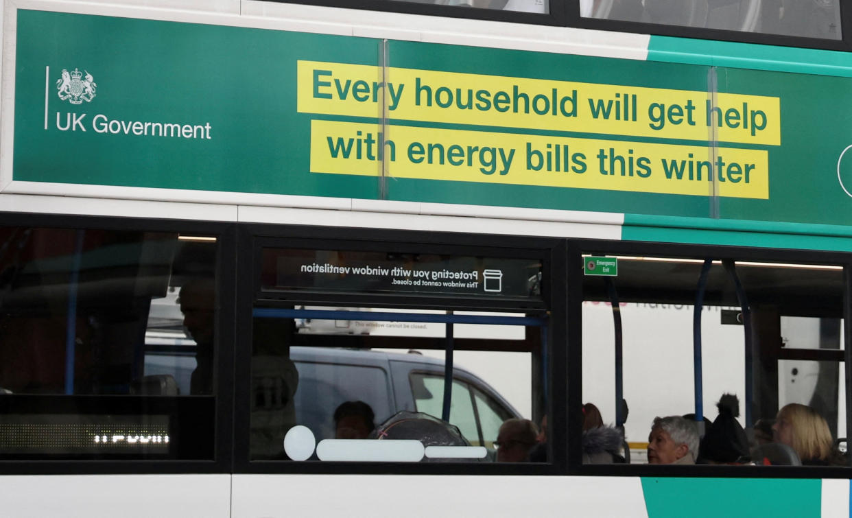 A British government advert offering people help with winter energy bills is seen on the side of a bus in Stockport, Britain, November 16, 2022. REUTERS/Phil Noble