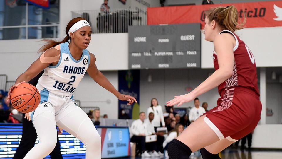 URI's Marie-Paule Foppossi looks for an opening against a St. Joseph's defender in the Atlantic 10 Tournament on Friday.