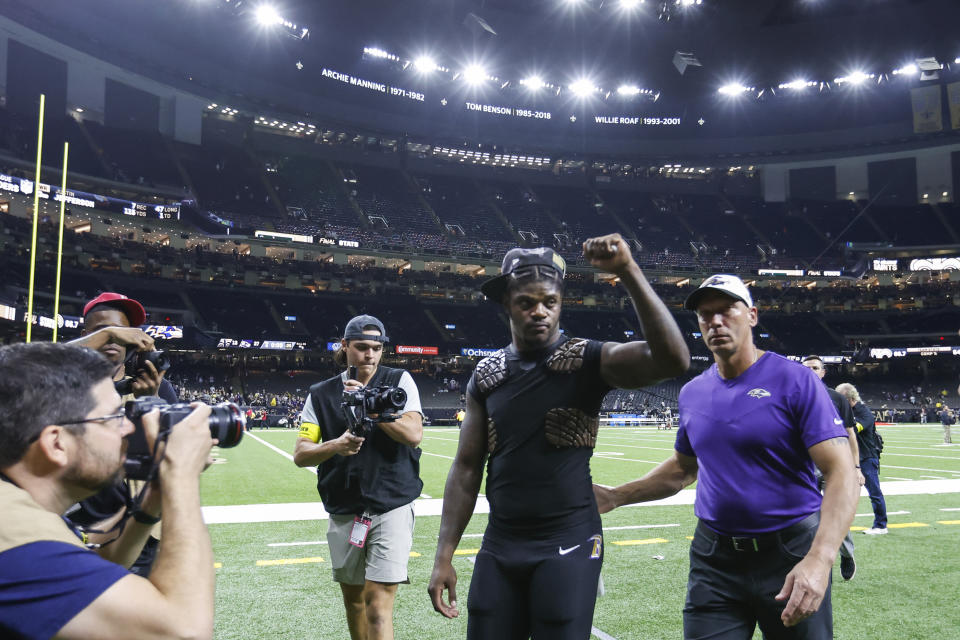 Baltimore Ravens quarterback Lamar Jackson, center, celebrates after an NFL football game against the New Orleans Saints in New Orleans, Monday, Nov. 7, 2022. The Ravens won 27-13. (AP Photo/Butch Dill)