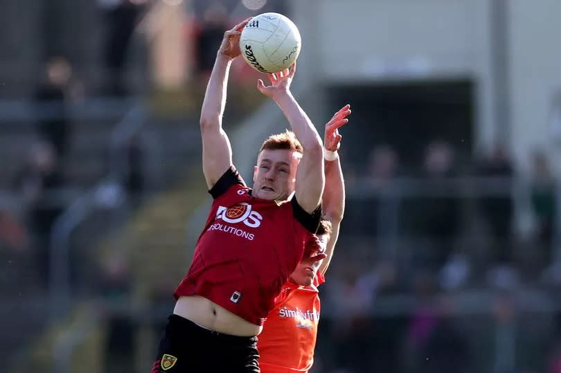 Down's Liam Kerr wins possession ahead of Armagh's Joe McElroy
