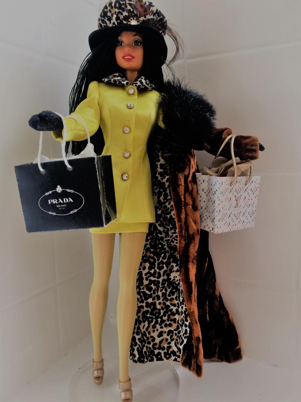 This provided photo from Friday, Feb. 22, 2019, shows a few favorite samples of Spartanburg native and former Barbie chief fashion designer Kitty Black Perkins' work. The dolls are on display at Perkins' home in Los Angeles.