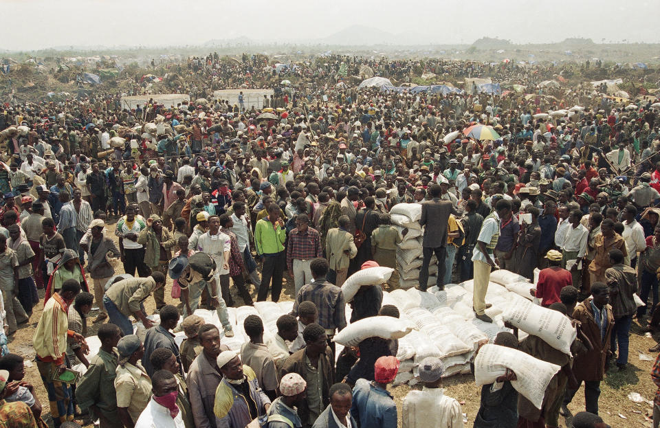 FILE - Thousands of Rwandan refugees wait to get food at the Mugunga camp near Goma, Democratic Republic of Congo, then known as Zaire, on July 27, 1994. A frail 87-year-old Rwandan, Félicien Kabuga, accused of encouraging and bankrolling the 1994 genocide in his home country goes on trial Thursday, Sept. 29, 2022, at a United Nations tribunal, nearly three decades after the 100-day massacre that left 800,000 dead. (AP Photo/Javier Bauluz, File)