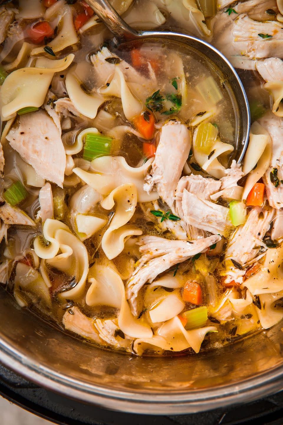 <p>Is there anything more comforting than a bowl of <a href="https://www.delish.com/uk/cooking/recipes/a31728080/homemade-chicken-noodle-soup-recipe/" rel="nofollow noopener" target="_blank" data-ylk="slk:Chicken Noodle Soup;elm:context_link;itc:0;sec:content-canvas" class="link ">Chicken Noodle Soup</a>? This Instant Pot recipe makes light work of this homestyle classic. Using the sauté feature, you can easily develop flavours by cooking the mirepoix (that's onions, carrots, and celery) before adding the remaining ingredients.</p><p>Get the <a href="https://www.delish.com/uk/cooking/recipes/a30252267/instant-pot-chicken-soup/" rel="nofollow noopener" target="_blank" data-ylk="slk:Instant Pot Chicken Noodle Soup;elm:context_link;itc:0;sec:content-canvas" class="link ">Instant Pot Chicken Noodle Soup</a> recipe.</p>