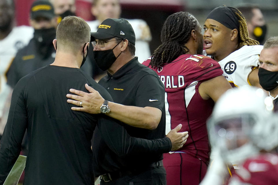 Washington Football Team head coach Ron Rivera, right, greets Arizona Cardinals head coach Kliff Kingsbury after an NFL football game, Sunday, Sept. 20, 2020, in Glendale, Ariz. The Cardinals won 30-15. (AP Photo/Ross D. Franklin)