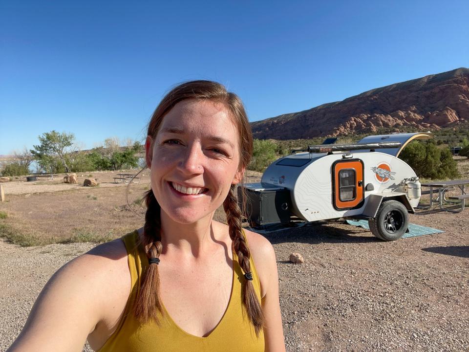 The author in front of the teardrop camper.