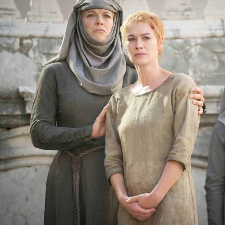 Hannah Waddingham stands behind Lena Headey