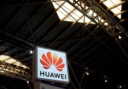 FILE PHOTO: A Huawei company logo is seen at the security exhibition in Shanghai