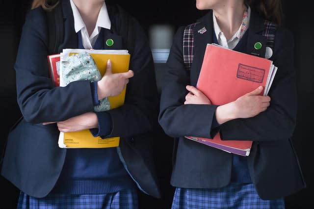 School pupils carrying books