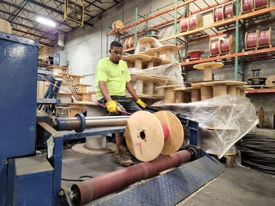 Wesco employee cutting wire in Kansas City, Kansas facility