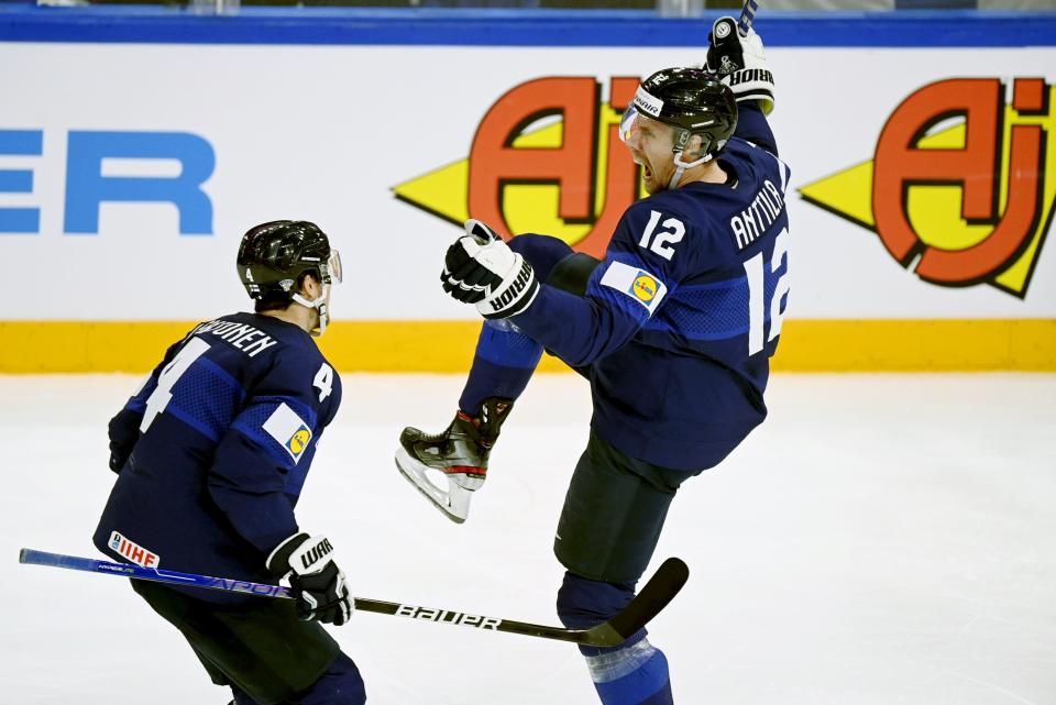 Marko Anttila of Finland, right, celebrates after scoring during the 2022 IIHF Ice Hockey World Championships semi-final match between Finland and Slovakia in Tampere, Finland, Thursday, May 26, 2022. (Vesa Moilanen/Lehtikuva via AP)