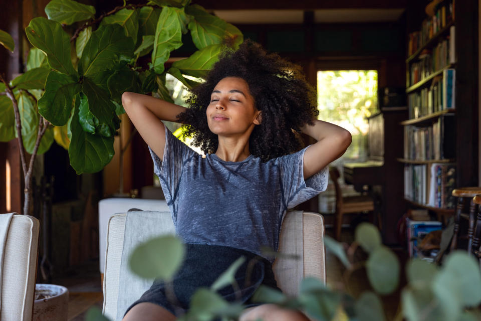 A woman relaxing in her living room