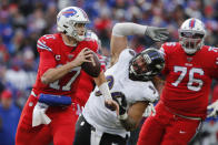 Buffalo Bills quarterback Josh Allen (17) rolls out looking to pass during the second half of an NFL football game against the Baltimore Ravens in Orchard Park, N.Y., Sunday, Dec. 8, 2019. (AP Photo/John Munson)