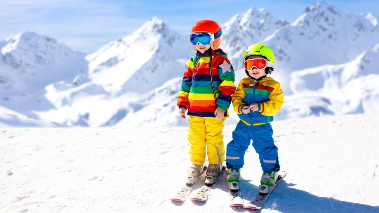 child skiing in the mountains kid in ski school winter sport for kids family christmas vacation in the alps children learn downhill skiing alpine ski lesson for boy and girl outdoor snow fun