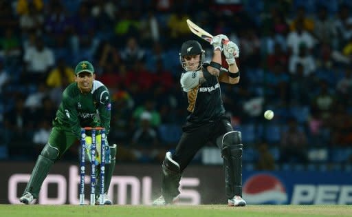 Pakistan wicket keeper Kamran Akmal watches as New Zealand batsman Brendon McCullum (right) plays a shot during the ICC Twenty20 Cricket World Cup match between Pakistan and New Zealand in Pallekele. Off-spinner Saeed Ajmal took four wickets as Pakistan kept their nerve to pull off an exciting 13-run win over New Zealand in the World Twenty20 group D match