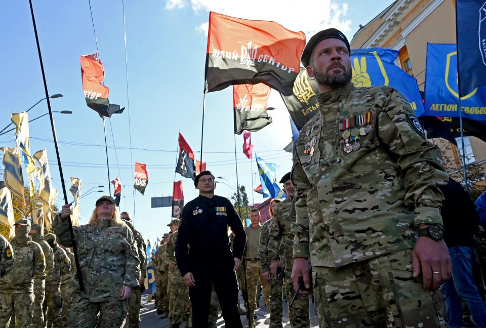 Ukrainian war veterans march as Nationalists movements demonstrate in front of President Volodymyr Zelensky's offices in Kiev in October last year. Source: Getty Images