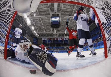 Ice Hockey – Pyeongchang 2018 Winter Olympics – Women Preliminary Round Match - U.S. v Canada - Kwandong Hockey Centre, Gangneung, South Korea – February 15, 2018 - Canada's Meghan Agosta scores against goalkeeper Madeline Rooney of the U.S. REUTERS/Grigory Dukor TPX IMAGES OF THE DAY