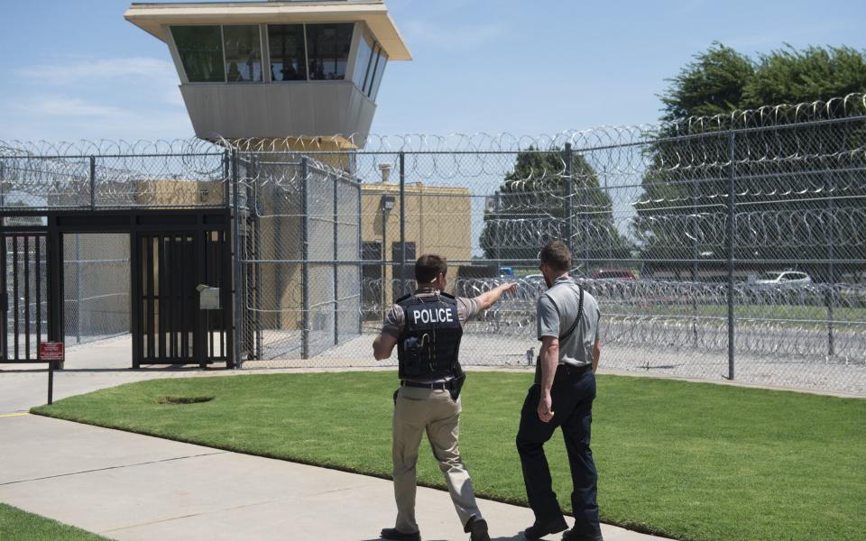 Guards patrol the Reno Federal Correctional Institution in El Reno, Oklahoma - Getty