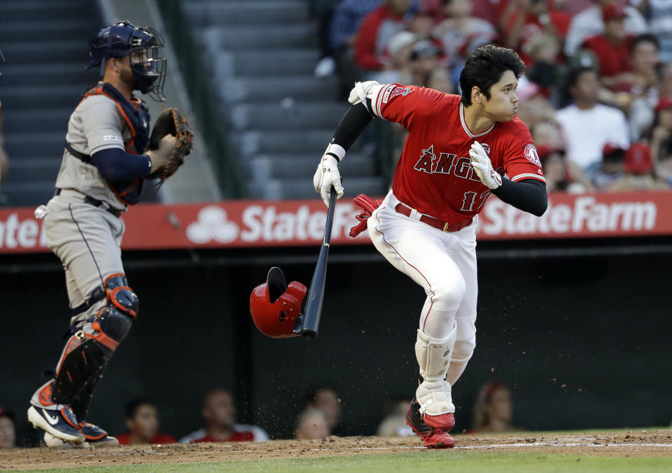 Los Angeles Angels' Shohei Ohtani heads to first on an RBI infield single against the Houston Astros during the first inning of a baseball game Tuesday, July 16, 2019, in Anaheim, Calif. (AP Photo/Marcio Jose Sanchez)