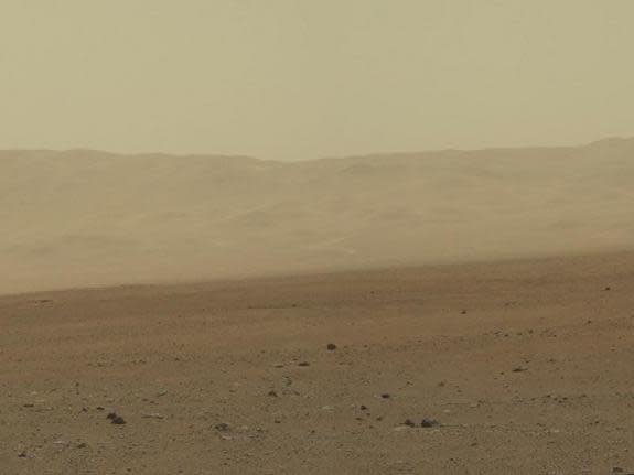 This color image from NASA's Curiosity rover shows part of the north wall of Gale Crater, the location on Mars where the rover landed on Aug. 5, 2012 PDT. The photo was snapped by Curiosity's Mastcam on Aug. 8.