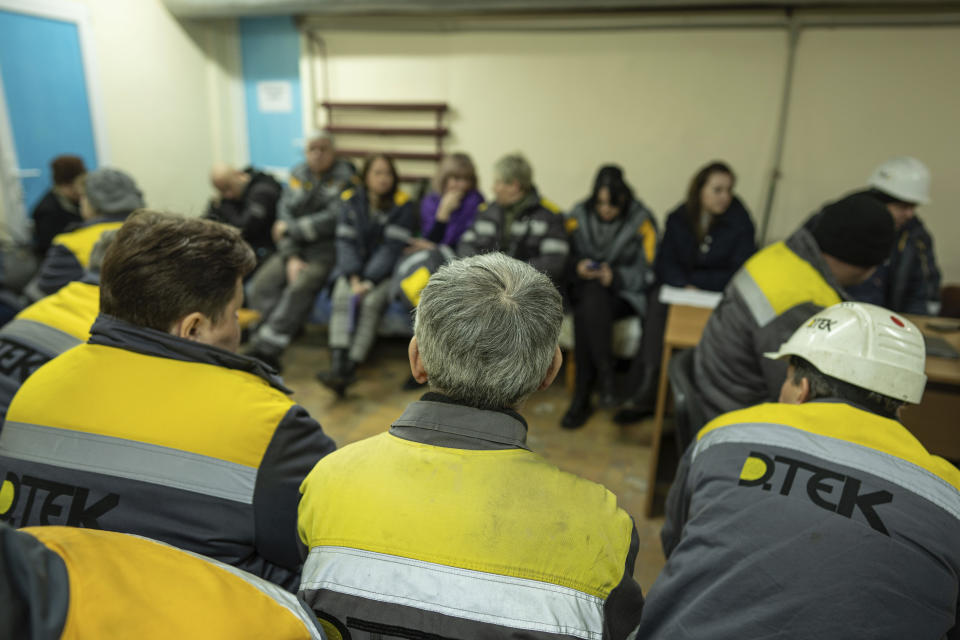 Power plant workers sit in a basement during an air raid alarm in central Ukraine, Thursday, Jan. 5, 2023. When Ukraine was at peace, its energy workers were largely unheralded. War made them heroes. They're proving to be Ukraine's line of defense against repeated Russian missile and drone strikes targeting the energy grid and inflicting the misery of blackouts in winter. (AP Photo/Evgeniy Maloletka)