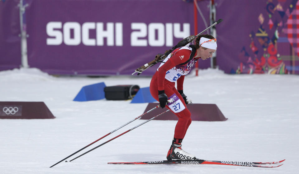 Switzerland's Selina Gasparin skis to winning the silver during the women's 15K individual biathlon race at the 2014 Winter Olympics, Friday, Feb. 14, 2014, in Krasnaya Polyana, Russia. (AP Photo/Matthias Schrader)