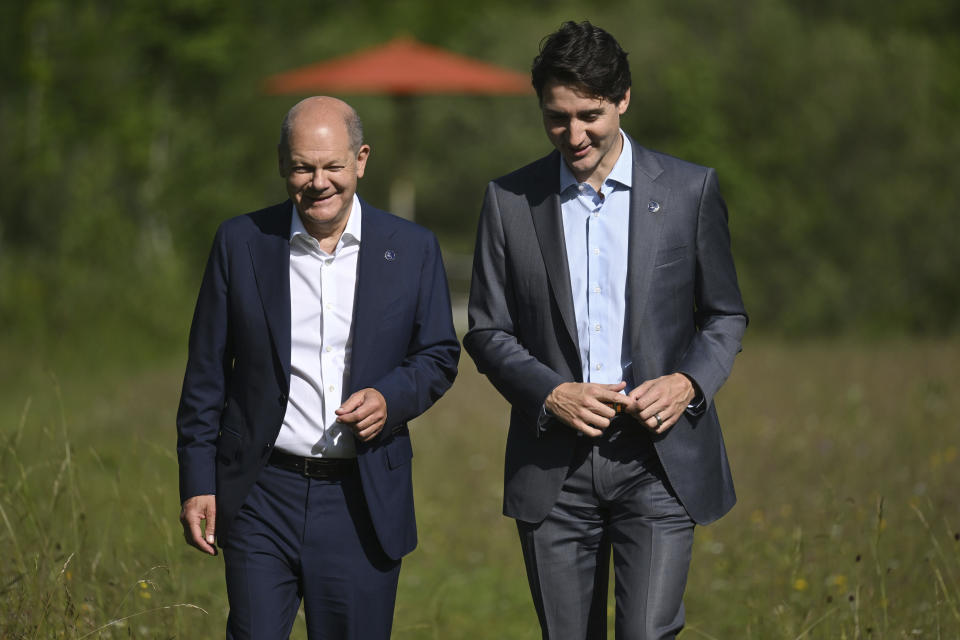 German Chancellor Olaf Scholz, left, and the Prime Minister of Canada, Justin Trudeau, right, take a walk during their bilateral meeting on the sidelines of the G7 summit at Castle Elmau in Kruen, near Garmisch-Partenkirchen, Germany, on Monday, June 27, 2022. The Group of Seven leading economic powers are meeting in Germany for their annual gathering Sunday through Tuesday. . (Kerstin Joensson/Pool Photo via AP)