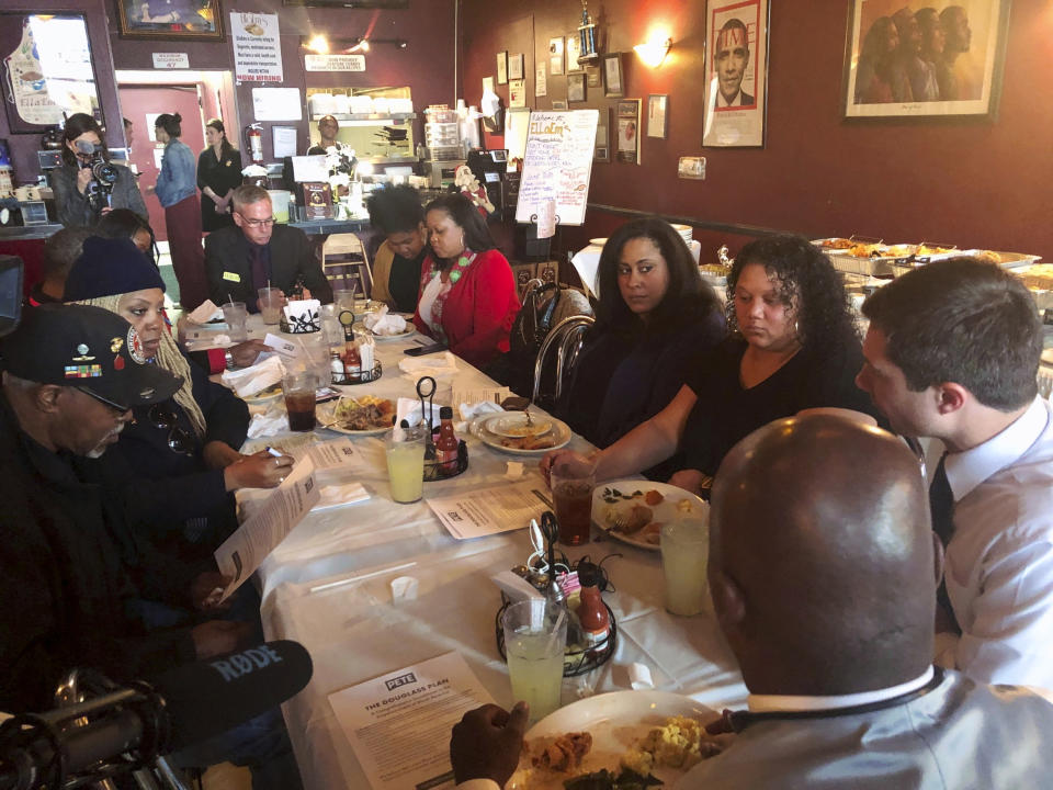 Democratic presidential candidate Pete Buttigieg meets with black voters at a soul food restaurant in North Las Vegas, Nev., Saturday, Dec. 21, 2019. (AP Photo/Michelle L. Price)