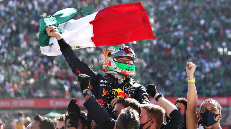 Sergio Perez of Red Bull Racing celebrates a podium position at the 2021 Formula 1 Mexican Grand Prix.
