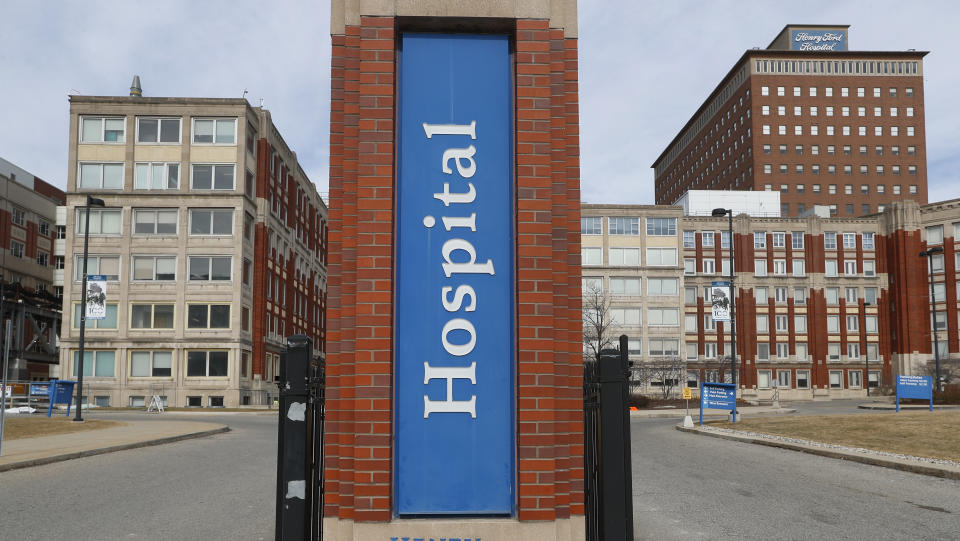 Henry Ford Hospital is shown in Detroit, Monday, March 16, 2020. U.S. hospitals are setting up triage tents, calling doctors out of retirement, guarding their supplies of face masks and making plans to cancel elective surgery as they brace for an expected onslaught of COVID-19 coronavirus patients. (Paul Sancya/AP)