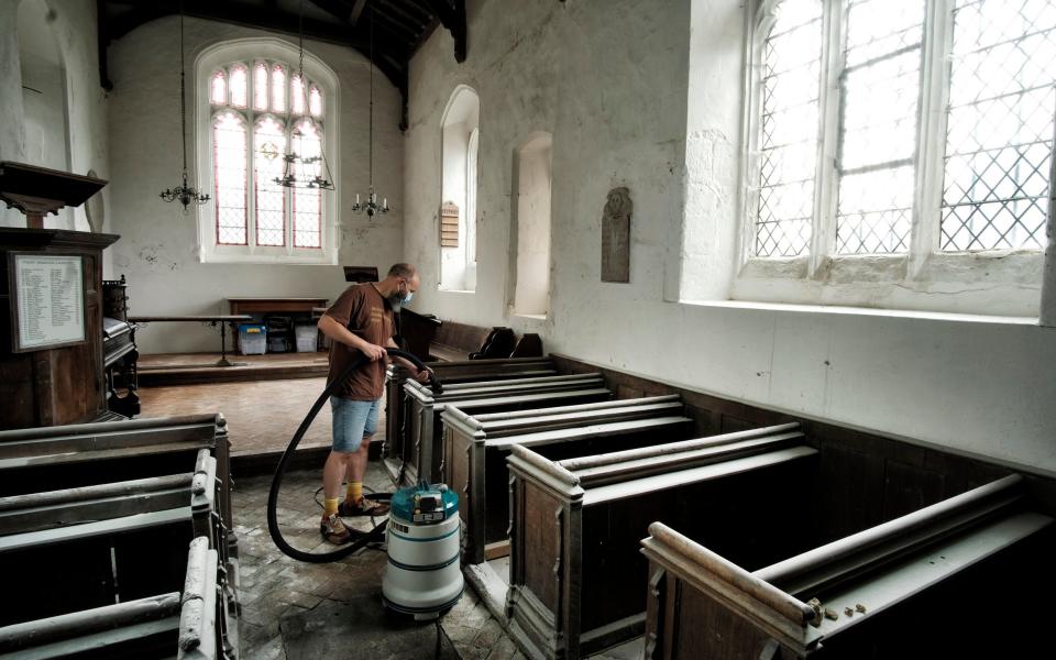 Volunteers clean up after St Mary Magdalene Caldecote in Hertfordshire was trashed by vandals