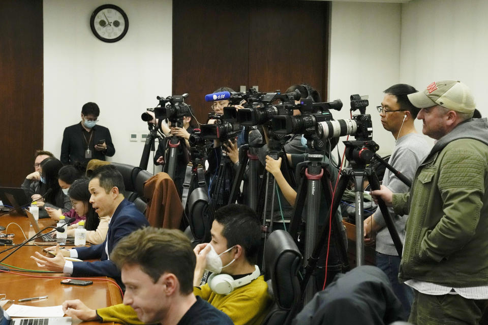 Foreign and local journalists report at a news conference at the Ministry of Foreign Affairs office in Beijing on April 26, 2023. China was the biggest global jailer of journalists last year with more than 100 behind bars, according to a press freedom group, as President Xi Jinping's government tightened control over society. (AP Photo/Andy Wong)