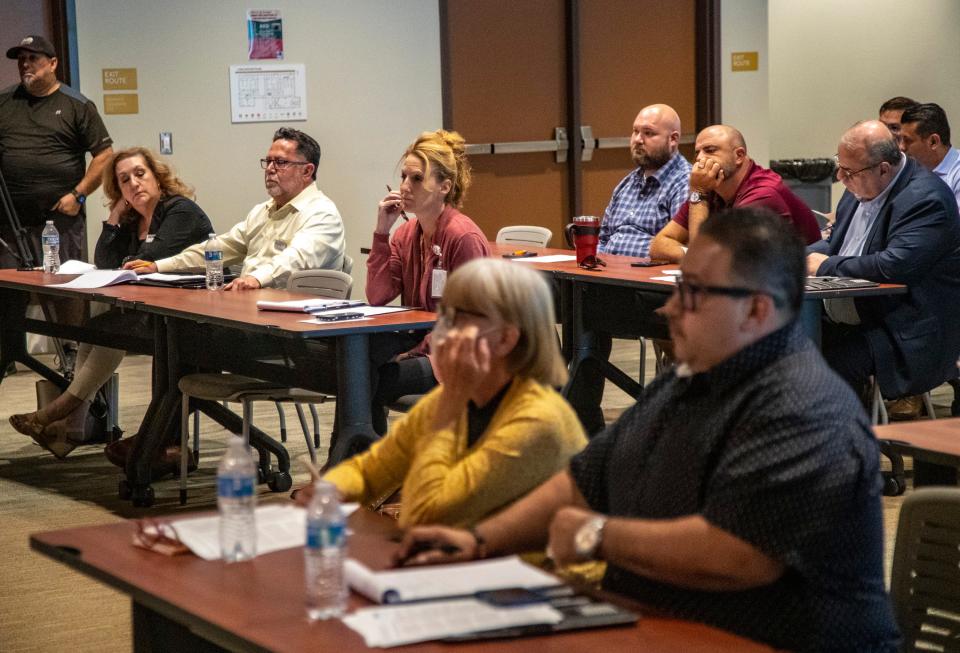 Local leaders and farm workers listen to U.S. Rep. Raul Ruiz and his team speak Tuesday during a roundtable in Thermal with local farmworker advocates and growers.