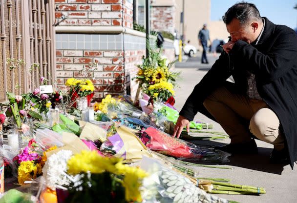 PHOTO: Monterey Park mayor Henry Lo kneels at a makeshift memorial outside the scene of a deadly mass shooting at a ballroom dance studio on Jan. 23, 2023 in Monterey Park, Calif. (Mario Tama/Getty Images)